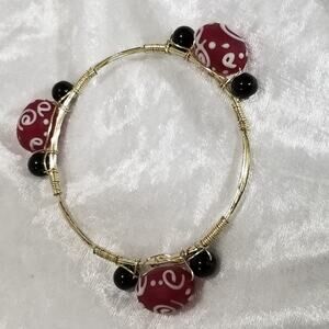 silver tone wired bracelet 2 1/2" opening 1.1976